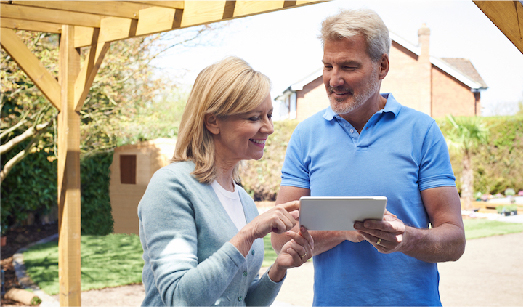 Woman and man conversing in garden